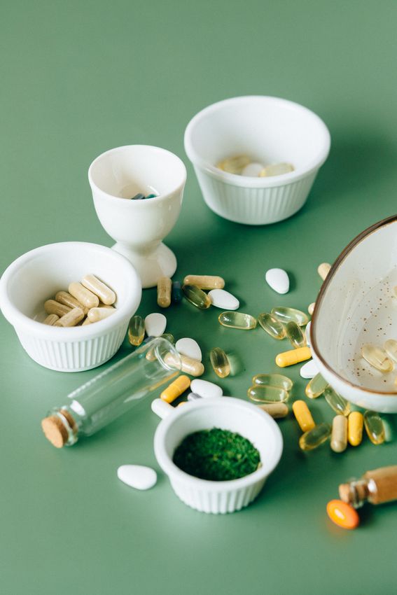 Leafy greens, fish and citrus fruits arranged on a table for eye health