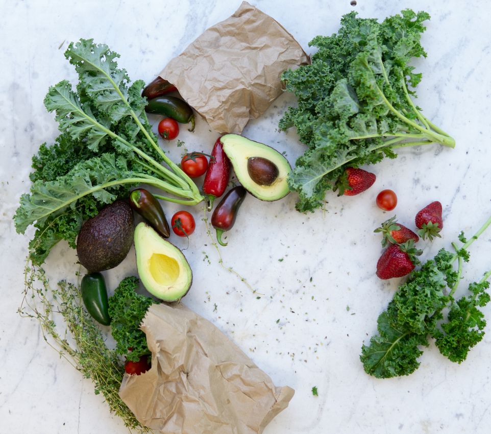 A colorful spread of vegetables, fruit, fish, nuts, and whole grains
