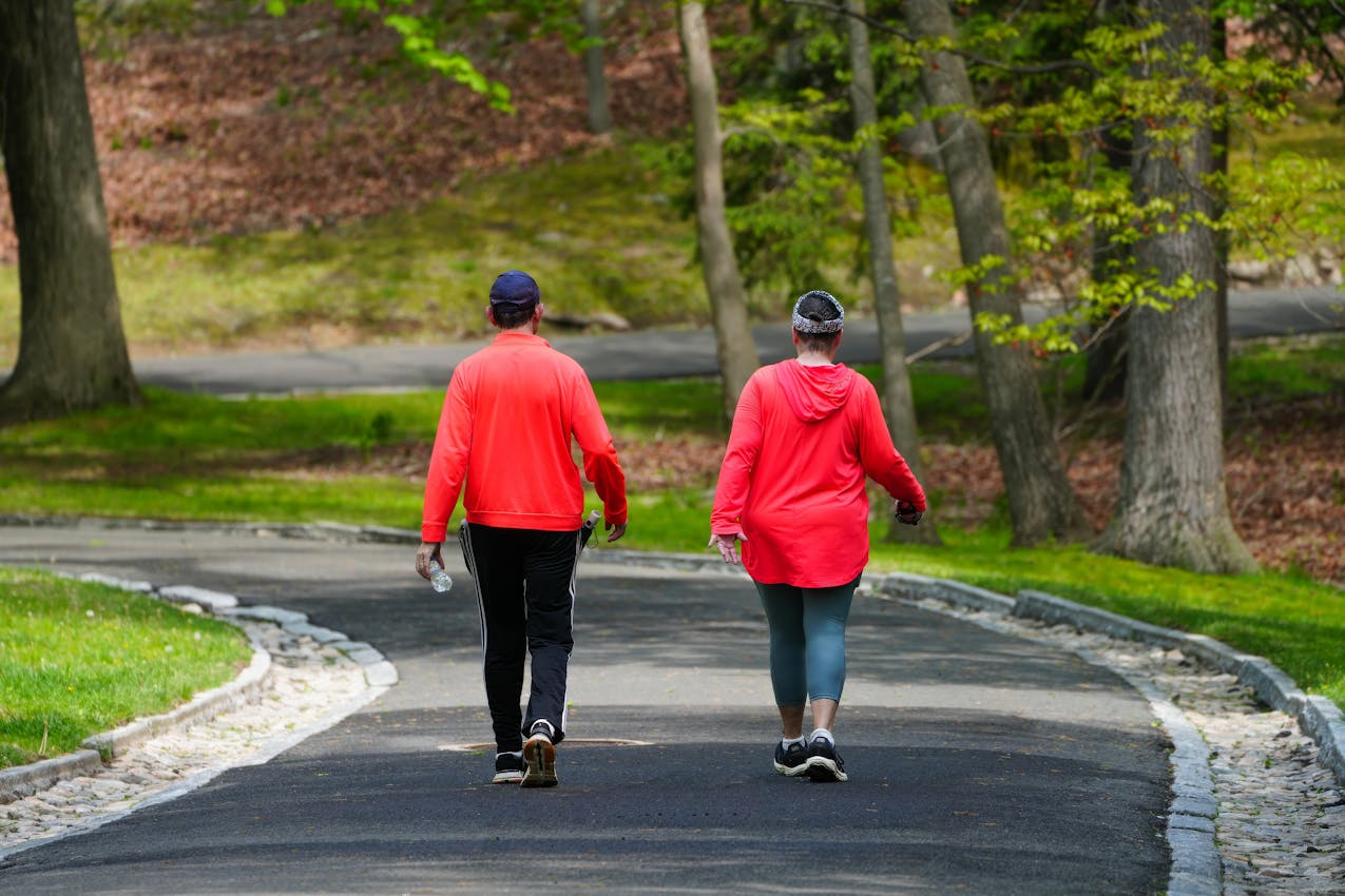 A person walking along an outdoor path in daylight